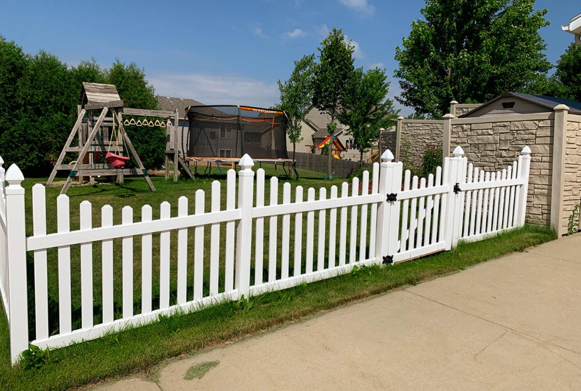 Durable white picket fence installation in Merced